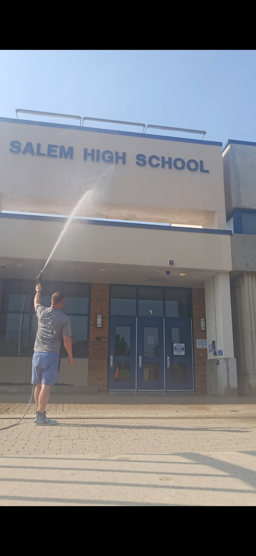 Soft washing the exterior of Salem High School